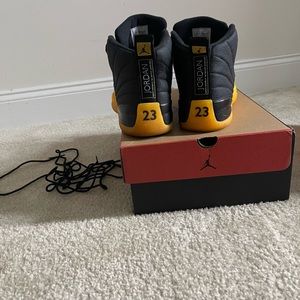 Brand is Jordans. Size 12. Color is Yellow and Black.